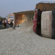 Image for article titled This Is What Happens When A Truck Full Of Crushed Stone Turns Over On A Car